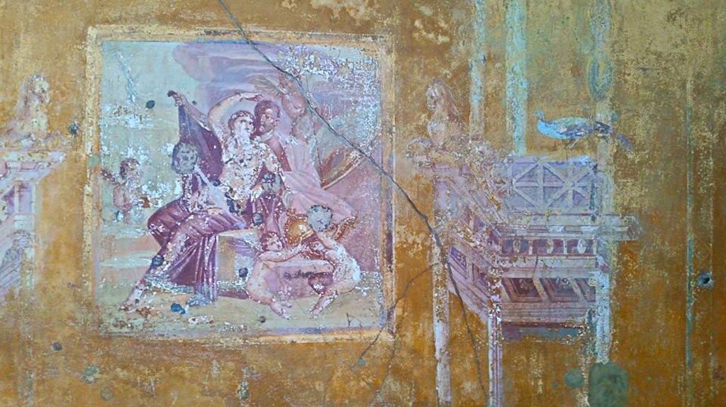 VI.16.15 Pompeii. 2015/2016.
Central painting of Ares and Aphrodite (Mars and Venus) in a group with cupids playing with the weapons of the god. from north wall of room G. Photo courtesy of Giuseppe Ciaramella.