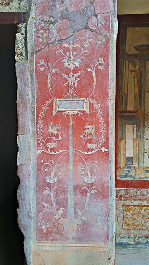 VI.16.15 Pompeii. 2015/2016.
Painted pilaster on west side of atrium B with doorway to room C, on left.
Photo courtesy of Giuseppe Ciaramella.