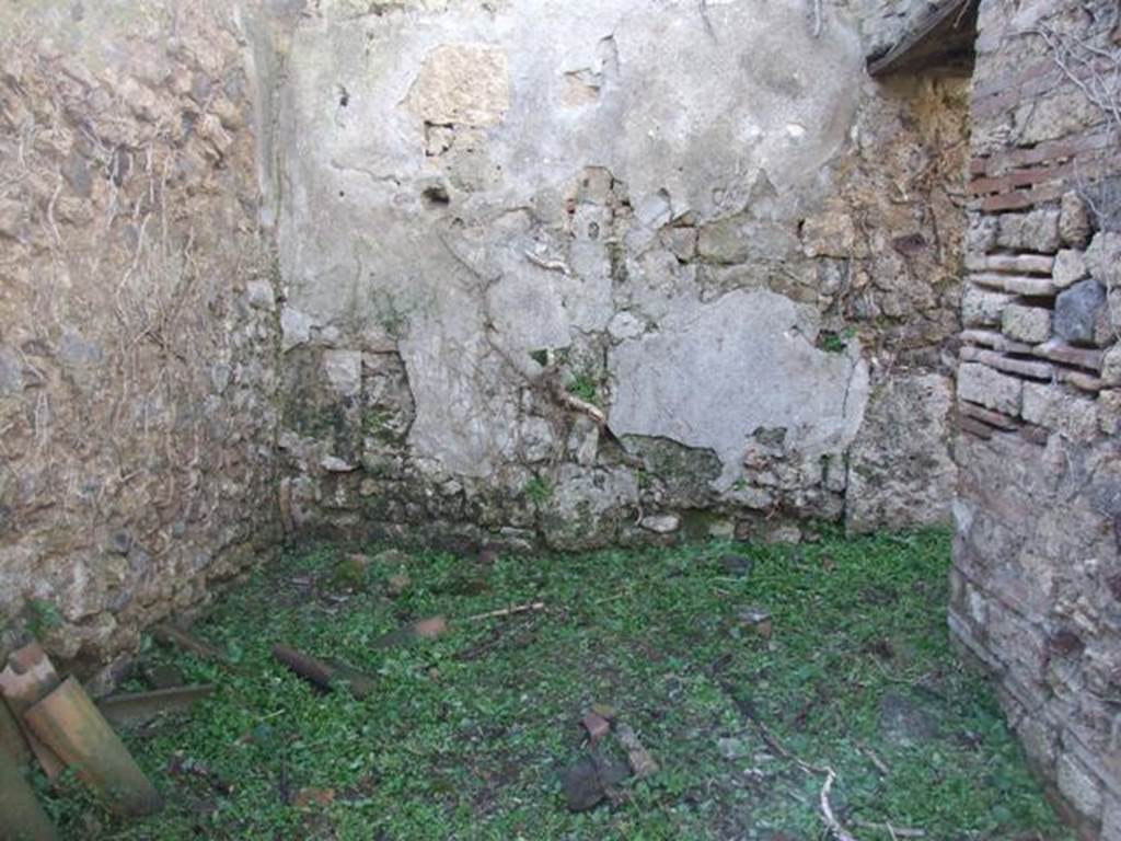 VI.16.18 Pompeii. March 2009. Looking west into room in centre on west side, with doorway into room in north-west corner.
