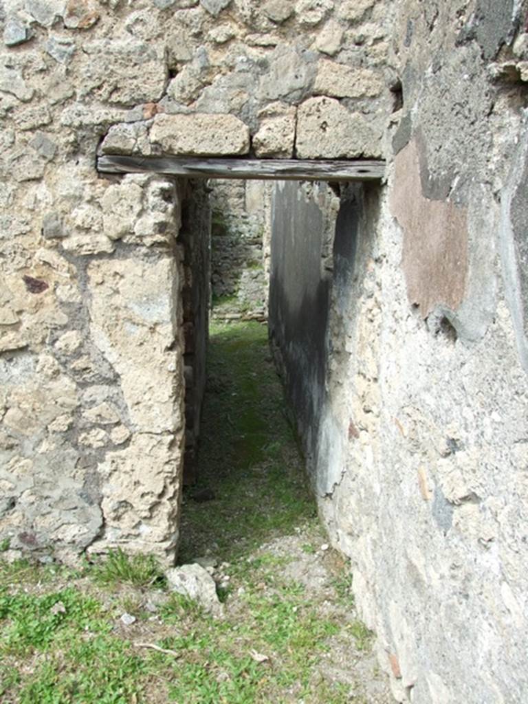 VI.16.27 Pompeii. March 2009. Looking north along corridor, towards stairs, from kitchen area.