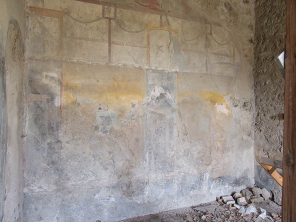 VI.16.27 Pompeii. March 2009. Room G, north wall of triclinium. According to NdS, the walls were divided into large panels with yellow background, between them was a broad black band. Painted on the black bands of the north wall were architetture fantastiche. Painted on the black bands of the west wall were arabesques and candlesticks. On the north wall were two panels, on the left (0.30m high x 0.31m wide) was Wounded Adonis. At the other end, on the right was a painting of equal size of Venus Fishing. See Notizie degli Scavi, 1908 (p.187)