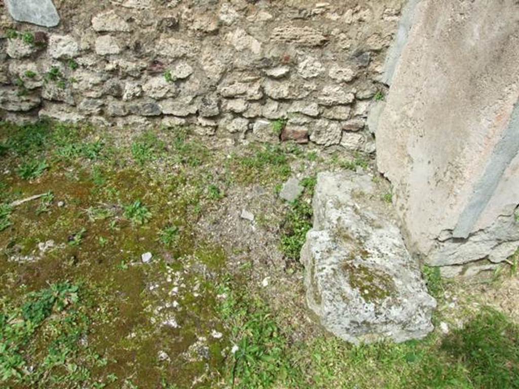 VI.16.29 Pompeii. March 2009. Room O, base of staircase to upper floor in north-east corner of atrium of VI.16.30. According to NdS, this area had an upper mezzanine, to which one went up by a staircase of which one could see the first step in Sarno stone at the foot of the north wall.