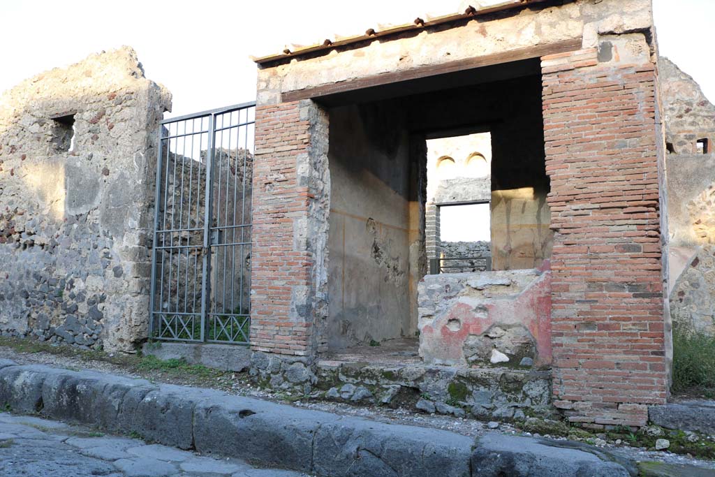 VI.16.33 Pompeii, on right. December 2018. Looking east to entrance doorway on Vicolo dei Vettii. 
The entrance to the atrium of VI.16.32 is on the left. Photo courtesy of Aude Durand.
