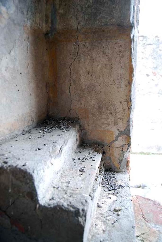 VI.16.33 Pompeii. May 2013. Shelving in south-west corner of bar, with remains of painted decoration. Photo courtesy of Paula Lock.

