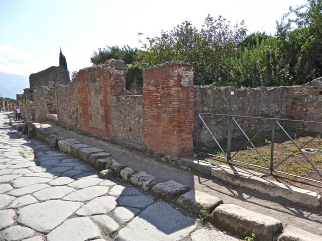 VI.17.10, 9 and 8 Pompeii. October 2014. Street façade on west side of Via Consolare, looking south. Photo courtesy of Michael Binns.