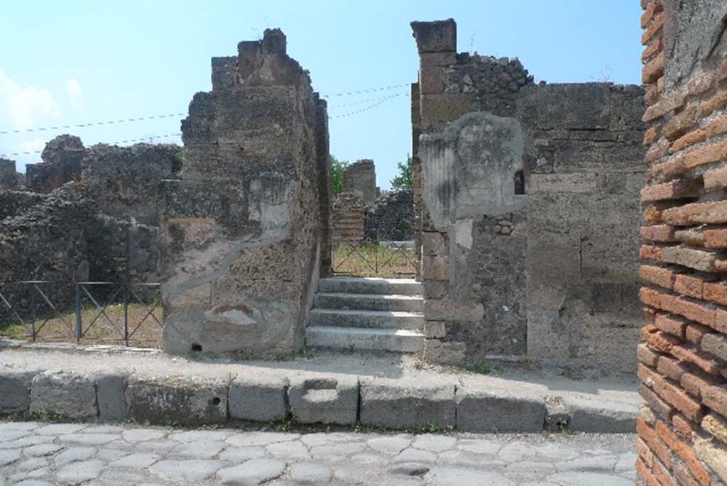 VI.17.32 Pompeii. July 2010. Entrance doorway on west side of Via Consolare.
Photo courtesy of Michael Binns.
According to Breton, the house was named after an inscription found on the pilaster facing the Academy of Music (VI.3.7).
This pilaster would have been on the north (right) side of the doorway �
C. IVLIVM POLYBIVM
II VIR.  MVLIONES ROG   [CIL IV 134]
See Breton, Ernest. (1855). Pompeia, decrite et dessine : 2nd ed. Paris : Baudry, (p.220).
