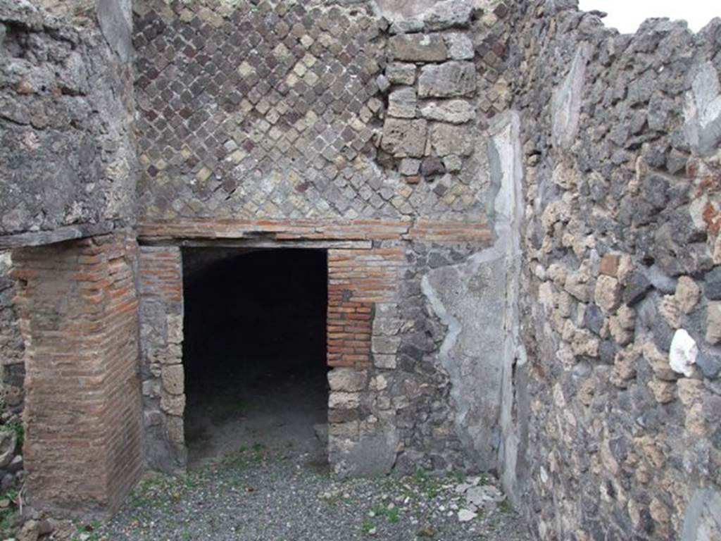 VI.17.34 Pompeii. December 2007. West wall and doorway to underground room.