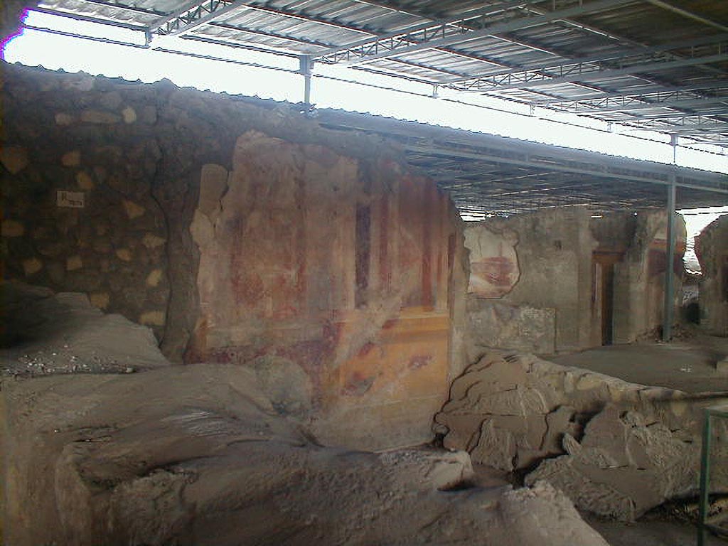 VI.17.41 Pompeii. September 2004.
Looking north-west towards west wall of triclinium with painted decoration, on south side of atrium.
