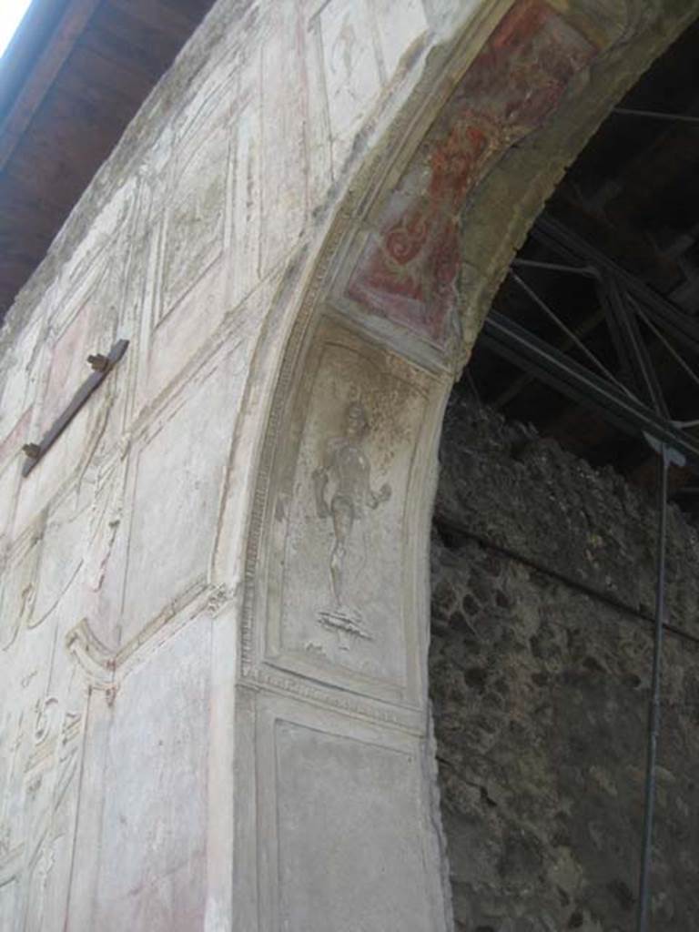 VII.1.8 Pompeii. July 2012. Nymphaeum F, east wall. Decorative stucco plasterwork figure on south side of arch. Photo courtesy of Sharon M. Wolf.