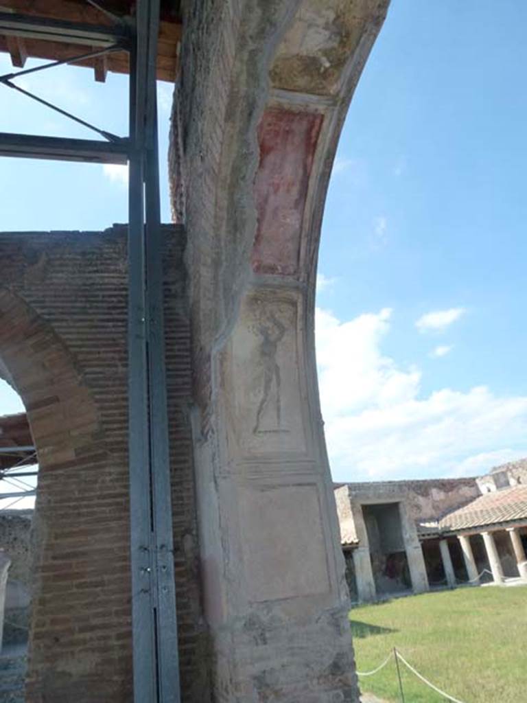 VII.1.8 Pompeii. June 2012. Nymphaeum F, east wall. Decorative stucco plasterwork on north side of arch. Photo courtesy of Michael Binns.