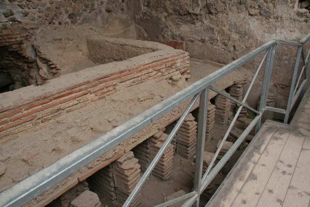 VII.1.8 Pompeii. April 2013. Men’s tepidarium 3, looking towards south-east corner, and detail of hypocaust system.
Photo courtesy of Klaus Heese.