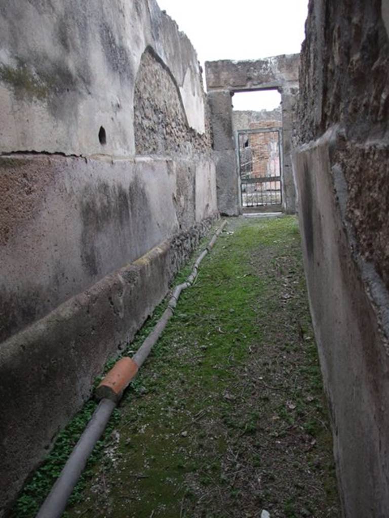 VII.1.8 Pompeii. December 2007. Women�s changing room 11. Looking east along corridor 12 to entrance at VII.1.17.
