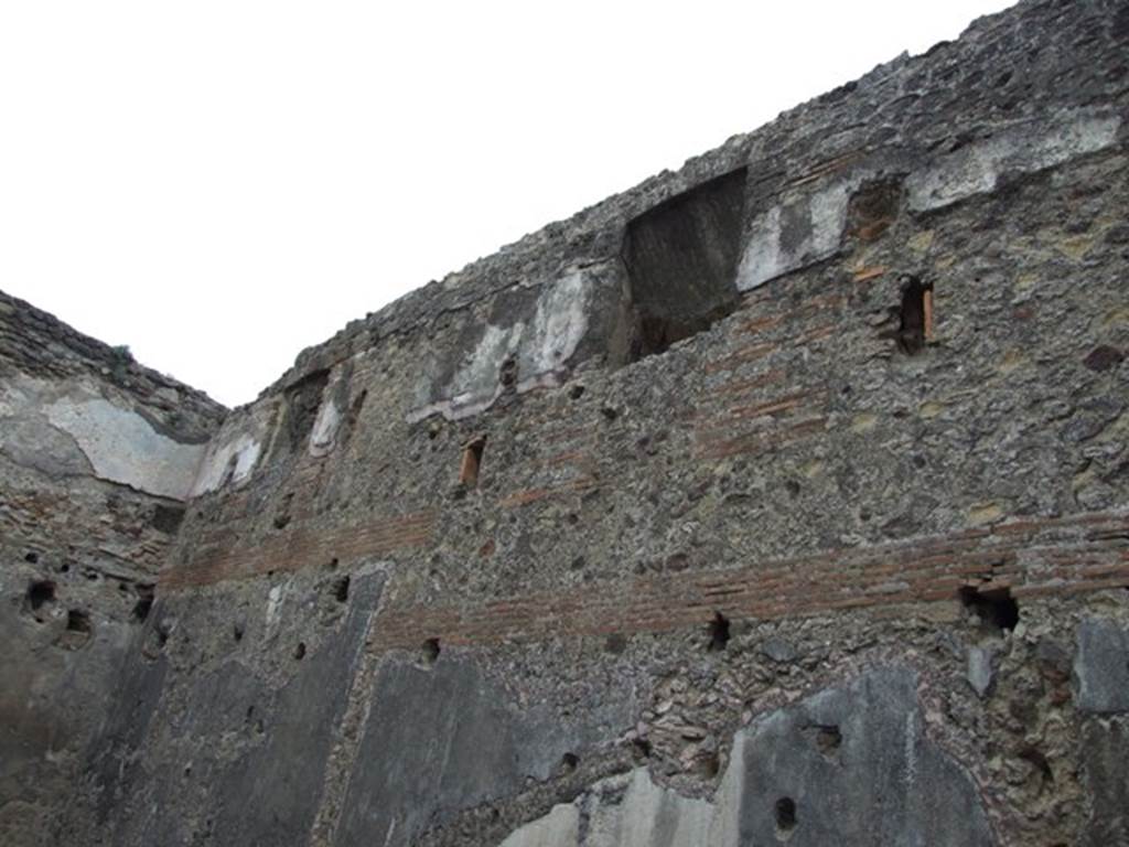VII.1.8 Pompeii. December 2007. Room 8, women’s baths anteroom, east wall showing upper floor.