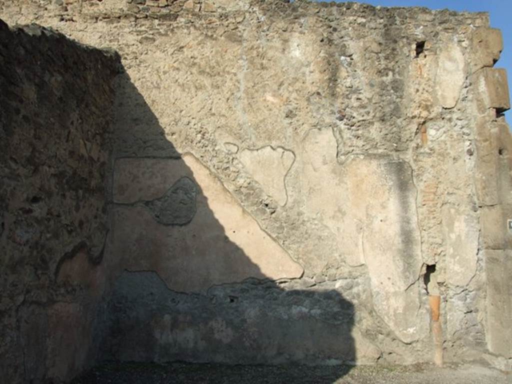 VII.1.12 Pompeii. December 2007. North wall with outline of staircase in plaster and waste pipe from upper floor.