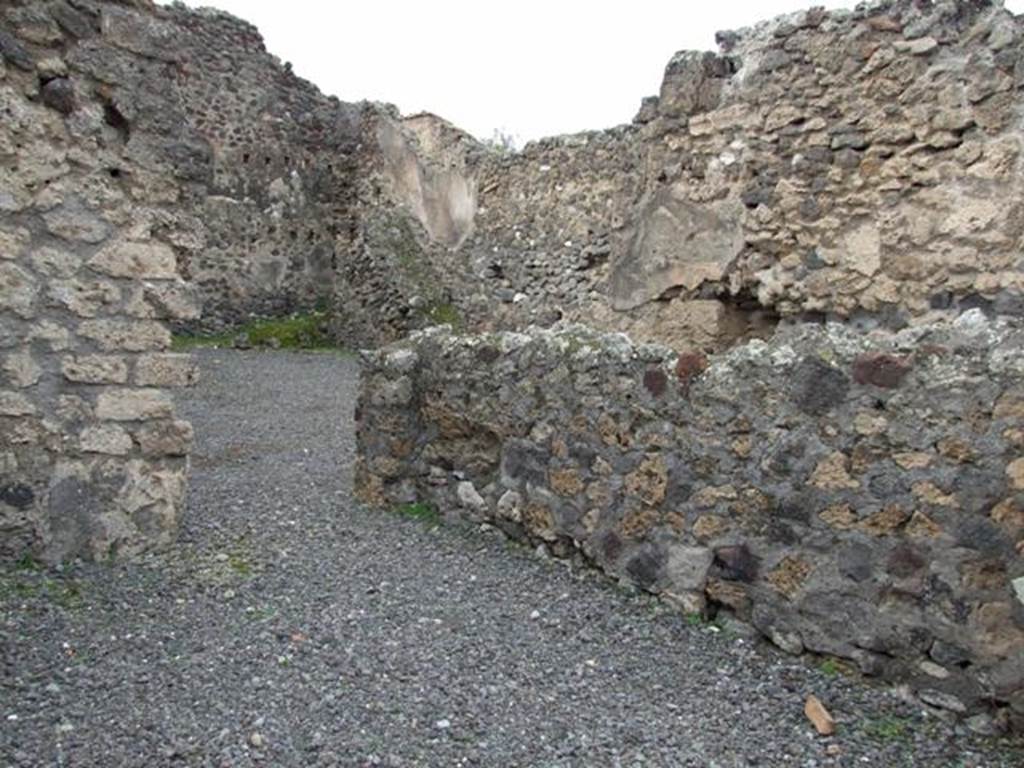 VII.1.21 Pompeii. December 2007. North wall of shop with entrance to atrium of VII.1.22 in north-west corner.