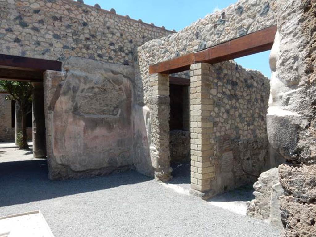 VII.1.25 Pompeii. May 2017. Looking towards north-west corner of atrium.
On the left is the entrance to the peristyle 31, and on the right are the doorways to rooms 28 and 27, on the north side of the atrium 24.
Photo courtesy of Buzz Ferebee.