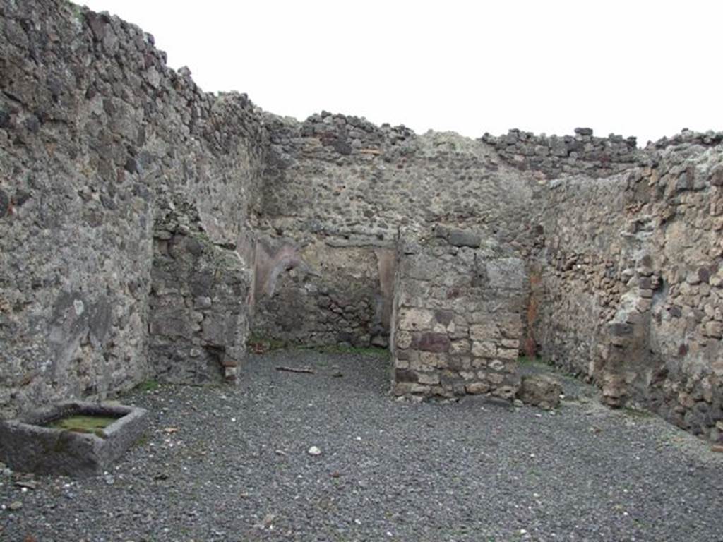 VII.1.31 Pompeii. December 2007. West wall with two rear rooms with outline of staircase on rear wall in room on left, which also contained the latrine.