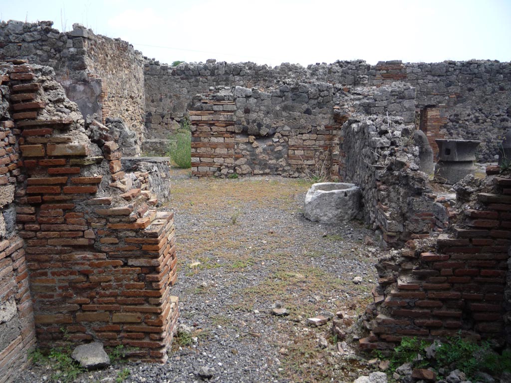 VII.1.36 Pompeii. October 2009.
Looking east to doorway to atrium from room in south-west corner of atrium. Photo courtesy of Jared Benton.