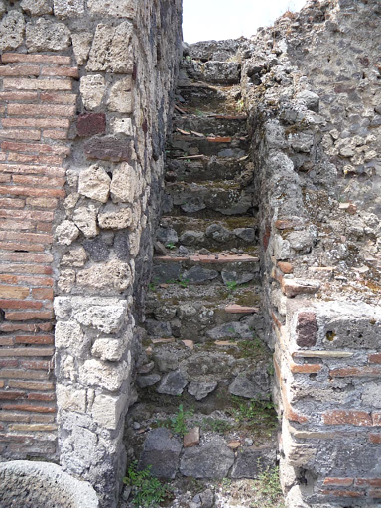 VII.1.36 Pompeii. October 2009.
Looking west to steps on north side of oven. Photo courtesy of Jared Benton.