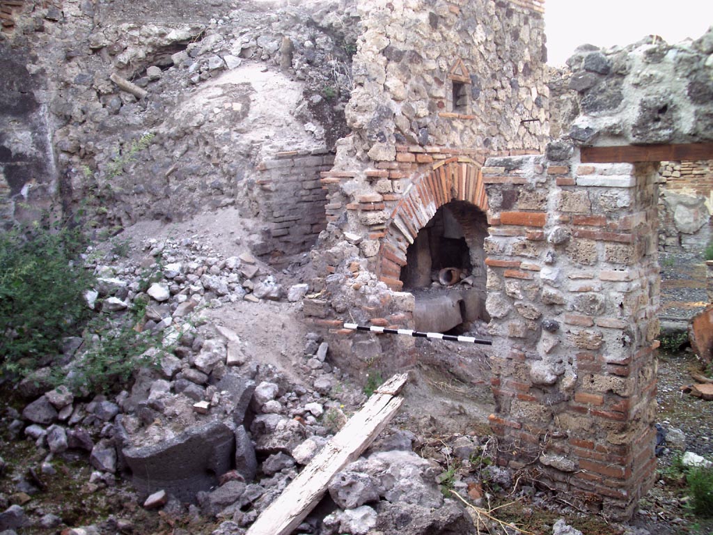 VII.1.36 Pompeii. August 2008. Looking north-west towards oven from room on south side. Photo courtesy of Jared Benton.