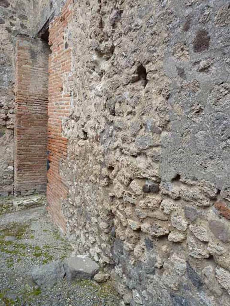 VII.1.46 Pompeii. May 2010.
East wall of rear room “a” with entrance to corridor 15.