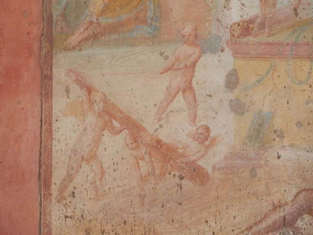 VII.1.47 Pompeii. May 2017. Exedra 10, detail from central painting on north wall.
Four Cupids are on the ground playing with the club of Hercules.
Photo courtesy of Buzz Ferebee.