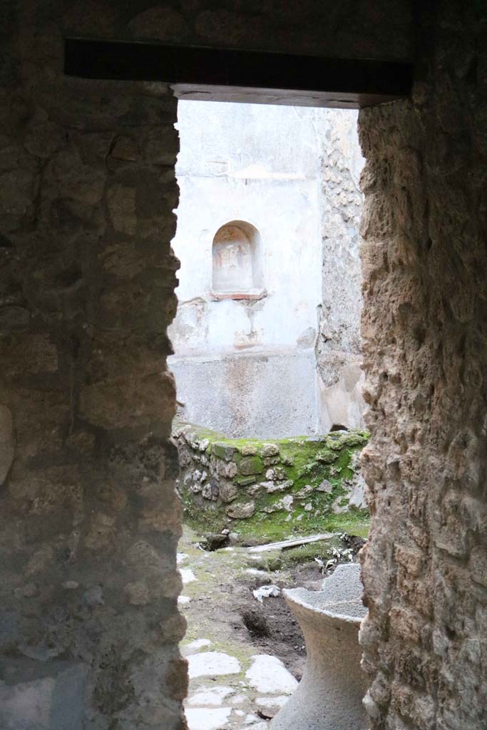 VII.1.47, Pompeii. December 2018.
Room 17, looking through doorway leading west towards room 12, and lararium in VII.1.46.
Photo courtesy of Aude Durand.