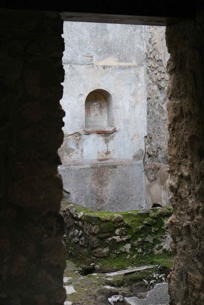 VII.1.47, Pompeii. December 2018.
Room 17, looking west through doorway towards lararium in VII.1.46. Photo courtesy of Aude Durand.