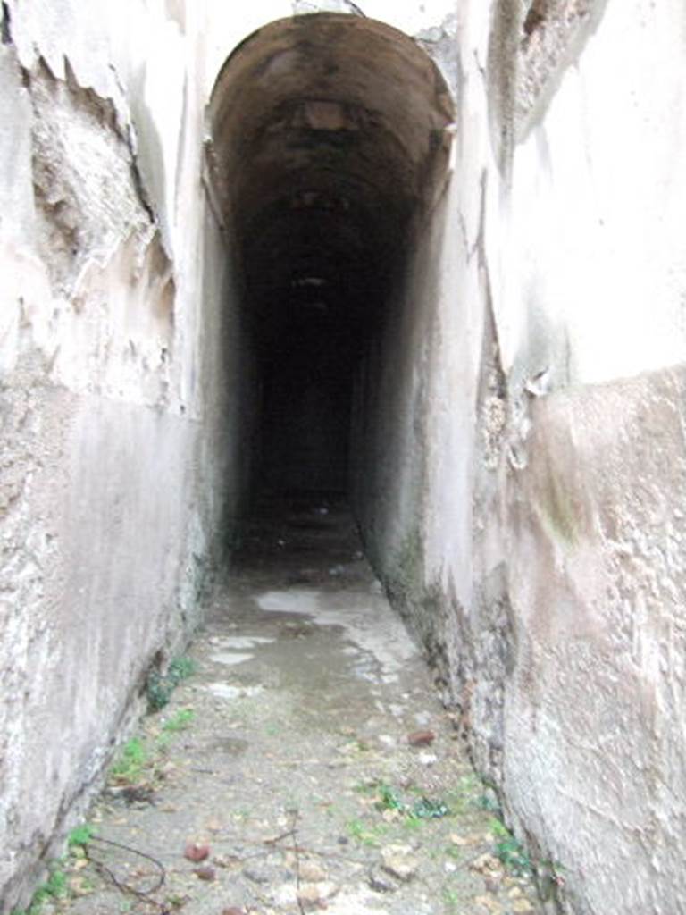 VII.1.48 Pompeii. December 2005. Looking east along corridor K. This leads to apodyterium (changing room) 11 of the women’s baths.