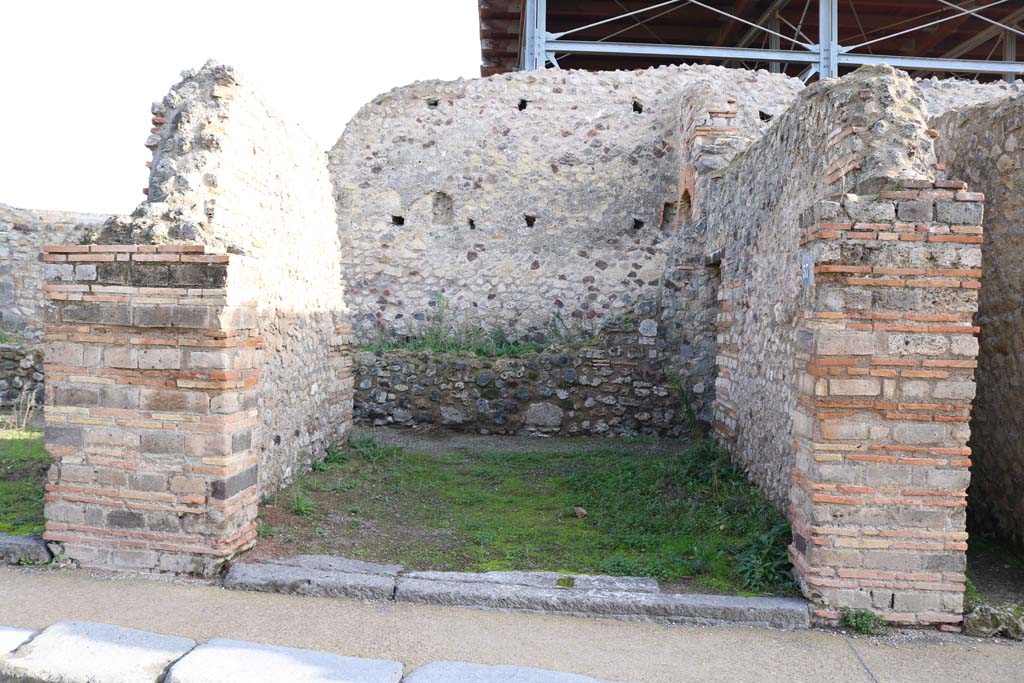 VII.1.57, Pompeii. December 2018.
Looking east to entrance doorway, and low east wall in front of, at least two storey east side of wall, (?) belonging to Stabian Baths.
Photo courtesy of Aude Durand.