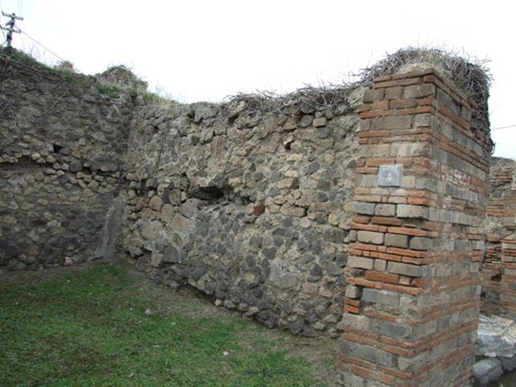 VII.2.4 Pompeii. December 2007. North wall and north-west corner.
Eschebach said there were steps to the upper floor at the rear on the right.