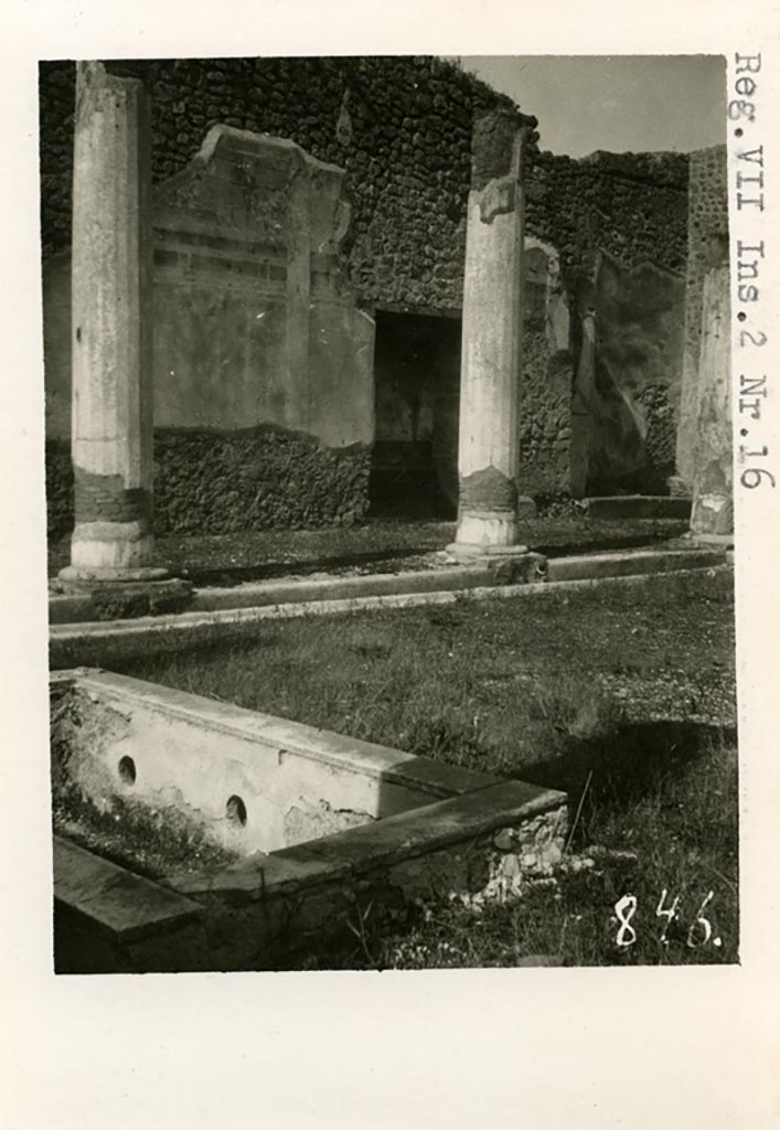 VII.2.16 Pompeii. Pre-1937-39.
Looking north-west across pool in peristyle towards lararium niche in west wall.
Photo courtesy of American Academy in Rome, Photographic Archive. Warsher collection no. 848.