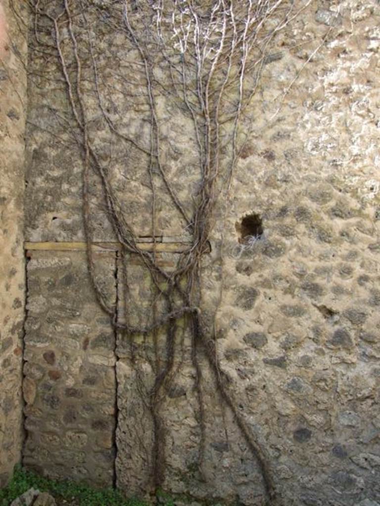 VII.2.18 Pompeii. March 2009. Room 9, west wall of cubiculum or porter’s room. This includes a blocked door, that used to lead to a small room under the staircase of VII.2.19.