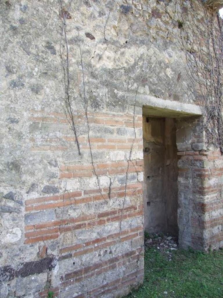 VII.2.18 Pompeii. March 2009. Doorway to Room 16. Cupboard.