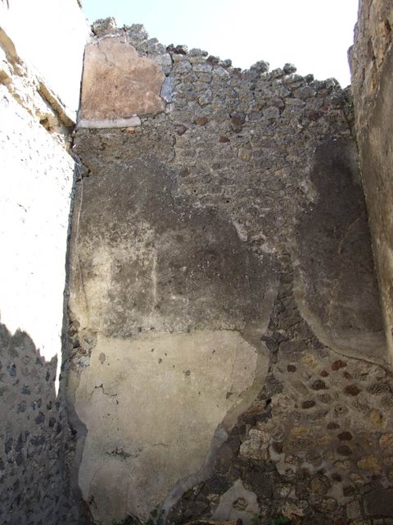 VII.2.18 Pompeii. March 2009. Room 2, east wall, and area of wall plaster in upper floor apartment.
