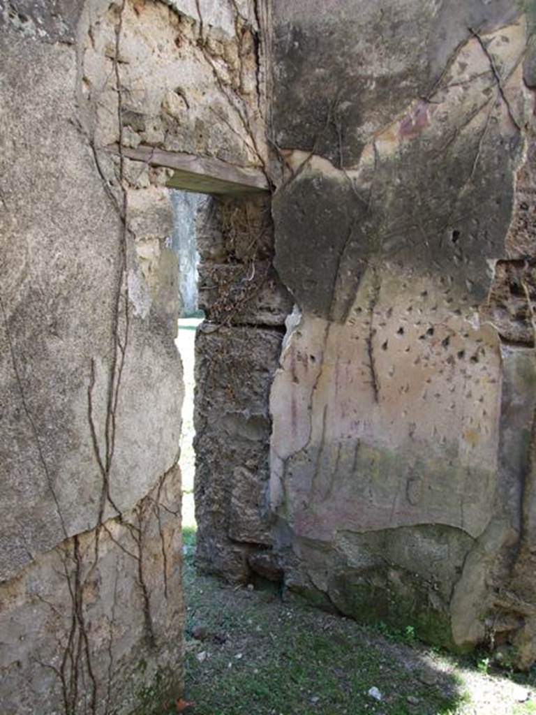 VII.2.20 Pompeii. March 2009. Room 4, cubiculum showing small door to room 5, in south-west corner.