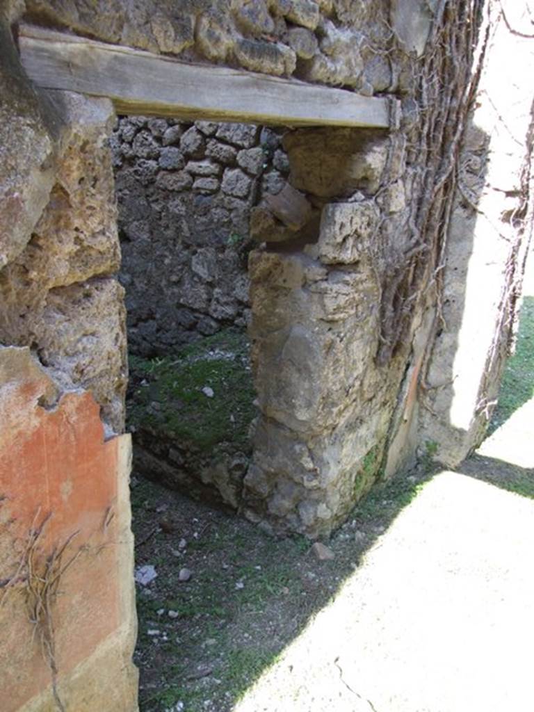 VII.2.20 Pompeii. March 2009. Doorway to Room 10, Small room for servants, in west wall of Corridor.