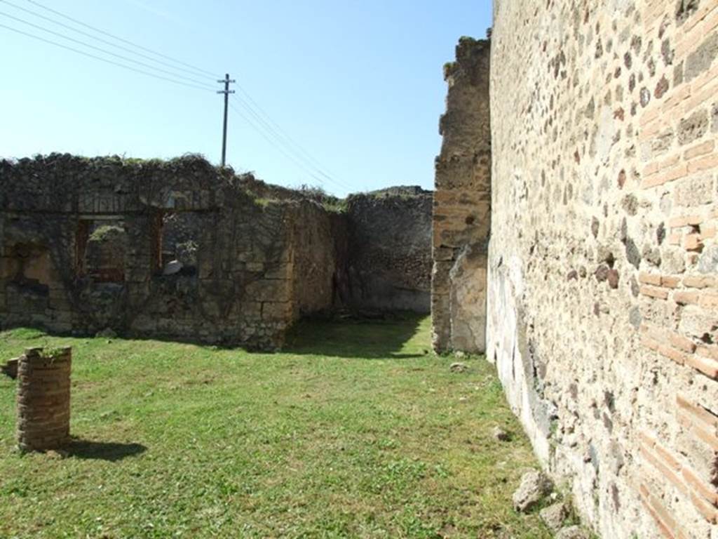 VII.2.20 Pompeii. March 2009. Looking west to room 12, triclinium, along north portico of peristyle area.