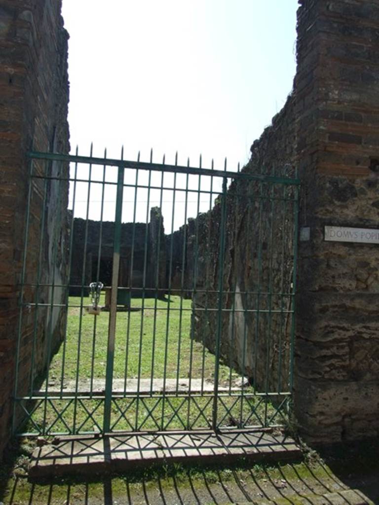VII.2.20 Pompeii. March 2009.
Entrance on south side of Vico del Panetierre, with short vestibule and then threshold for fauces.
According to Pagano –
“Vicoletto tra la via Stabiana e il vico Storto.
Sui due lati di questo breve vicoletto veggonsi parecchie abitazioni, che tornarono a luce verso gli ultimi mesi del 1857, ma tutte sono di poca importanza, meno l’ultima a sinistra scavata nel 1864, notevole per la sua grandezza, e per altre considerazioni ancora.
Infatti vi si scorgono tre tondi che ritraggono Paride con l’Amorino sulla destra spalla, una scrittrice col dittico nella destra e lo stilo avvicinato alla bocca, infine i busti di Marte e Venere. Vi si rinvennero gli scheletri di due cavalli, e una gran provvista di marmi colorati, dai quali ha preso l’abitazione il nome di Casa dei marmi colorati.
Ma le due piu importani scoverte che vi si fecero, sono il pozzo alto 110 palmi e trovato con una considerevole quantita di acqua, e la statuetta in bronzo del Sileno ubbriaco, che era tra le piu belle sculture del Museo Nazionale. Questa casa ha una seconda porta sul Vico degli Augustali.”
See Pagano, N. (1868). Guida di Pompei, 2nd ed. (p.42)
(translation -
On both sides of this short vicolo we see several dwellings, which came to light towards the last months of 1857, but all are of little importance, except the last to the left excavated in 1864, remarkable for its greatness, and also for other considerations. In fact, found here were three medallions which portray Paris with a Cupid on his right shoulder, a female writer with the diptych in her hand, and stylus approaching the mouth, and finally the busts of Mars and Venus.
Also found here were the skeletons of two horses, and a large supply of colored marble, from which the house took the name of House of Coloured Marbles.
But the two most important discoveries that were found here, was the well 110 palms deep and found with a considerable amount of water, and the bronze statuette of the Drunken Silenus which is amongst the most beautiful sculptures of the National Museum. This house has a second doorway onto the Via degli Augustali.)