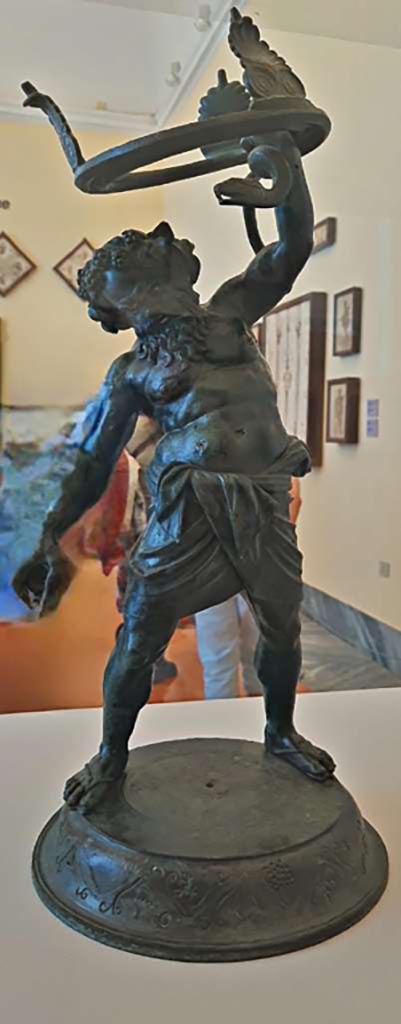 VII.2.20 Pompeii. October 2023.
Bronze statuette of Drunken Silenus. Photo courtesy of Giuseppe Ciaramella.
On display in “L’altra MANN” exhibition, October 2023, at Naples Archaeological Museum, inv. 5001.