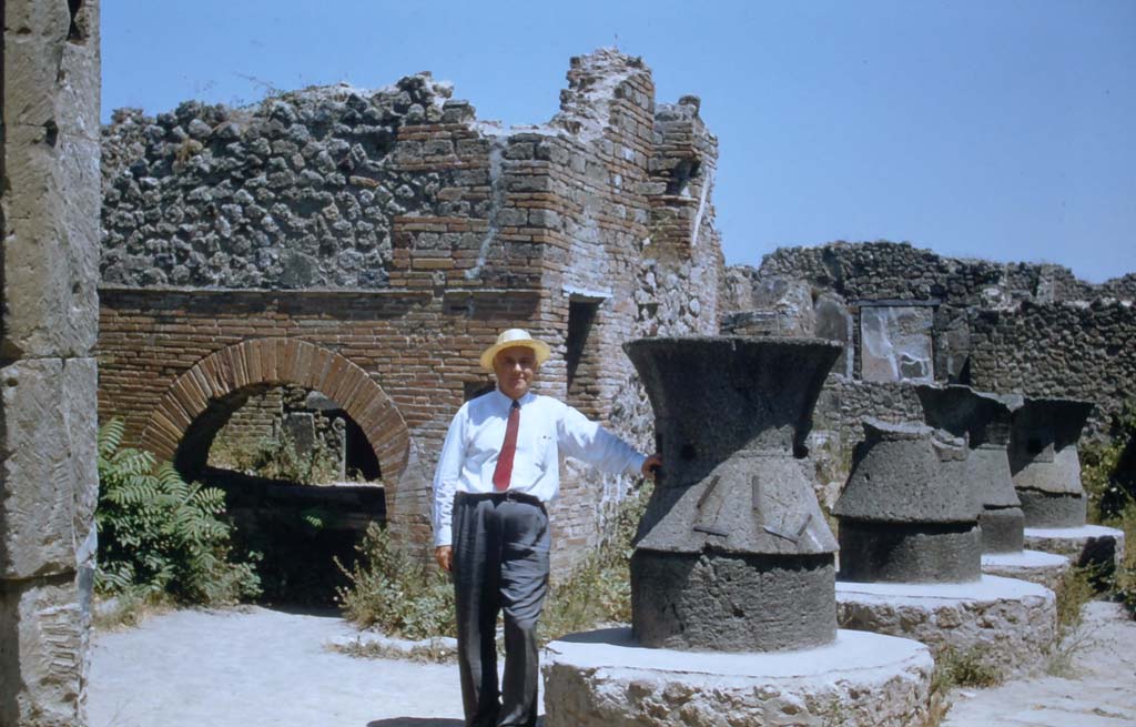 VII.2.22 Pompeii. 1950’s. Looking towards oven and mills in bakery. Photo courtesy of Rick Bauer.