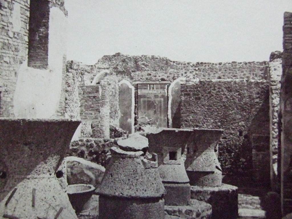 VII.2.22 Pompeii. Old undated photograph. Looking east across mills towards remaining panted decoration on east wall.
Courtesy of Society of Antiquaries. Fox Collection.