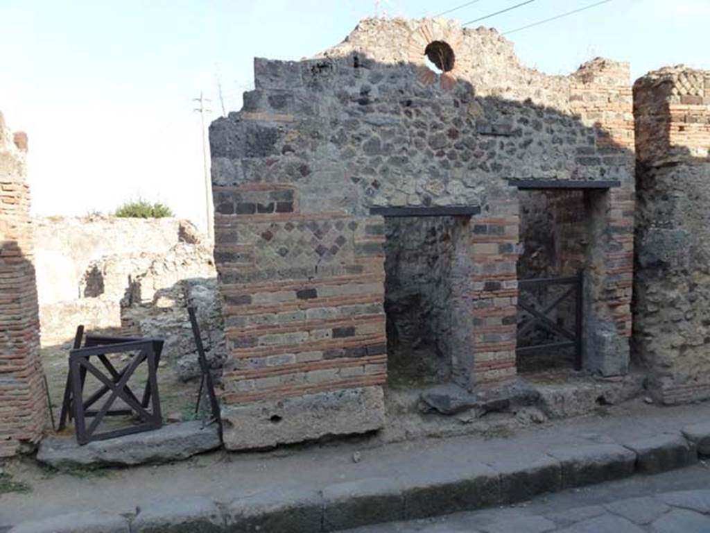 VII.2.27 Pompeii, on left, and VII.2.28, centre, and VII.2.29, on right. September 2011. Looking east to doorways. Photo courtesy of Michael Binns.