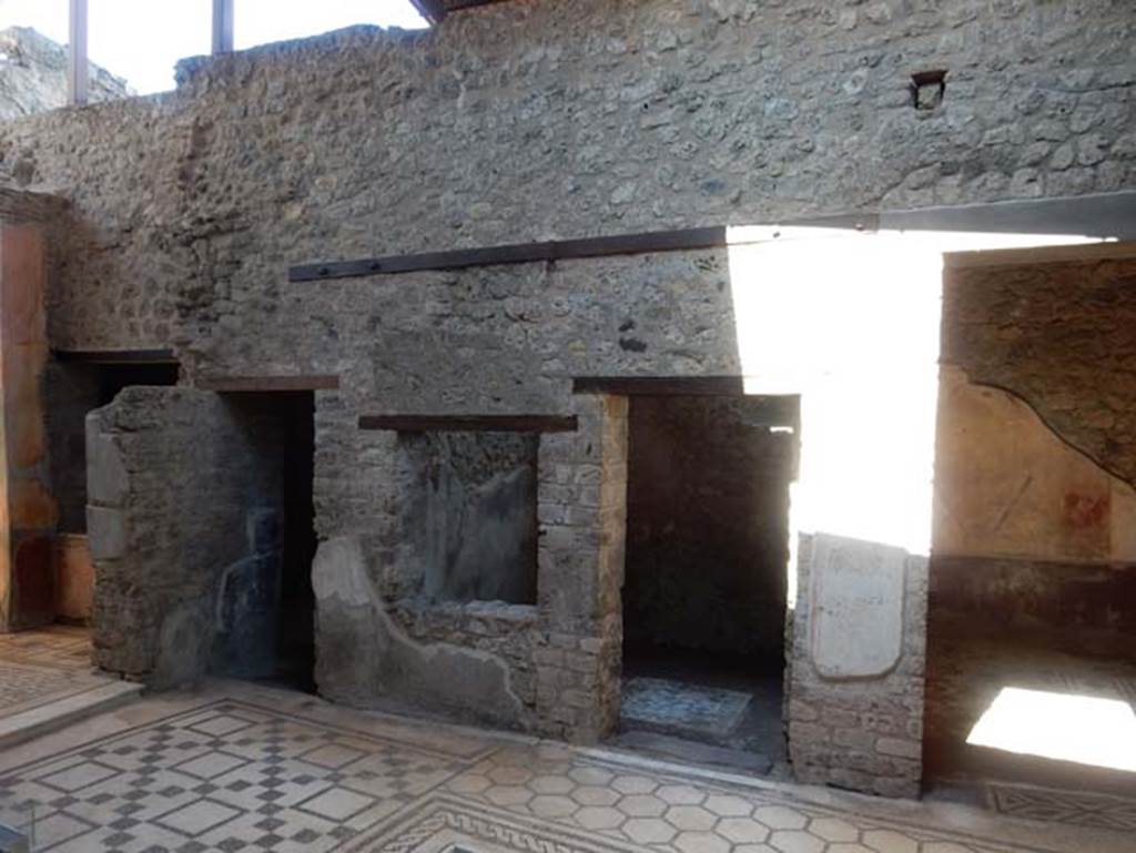 VII.2.45 Pompeii, May 2018.
Looking east across atrium towards doorway to triclinium, on left, window and doorway to cubiculum, in centre, and doorway to triclinium in south-east corner, on right. Photo courtesy of Buzz Ferebee.