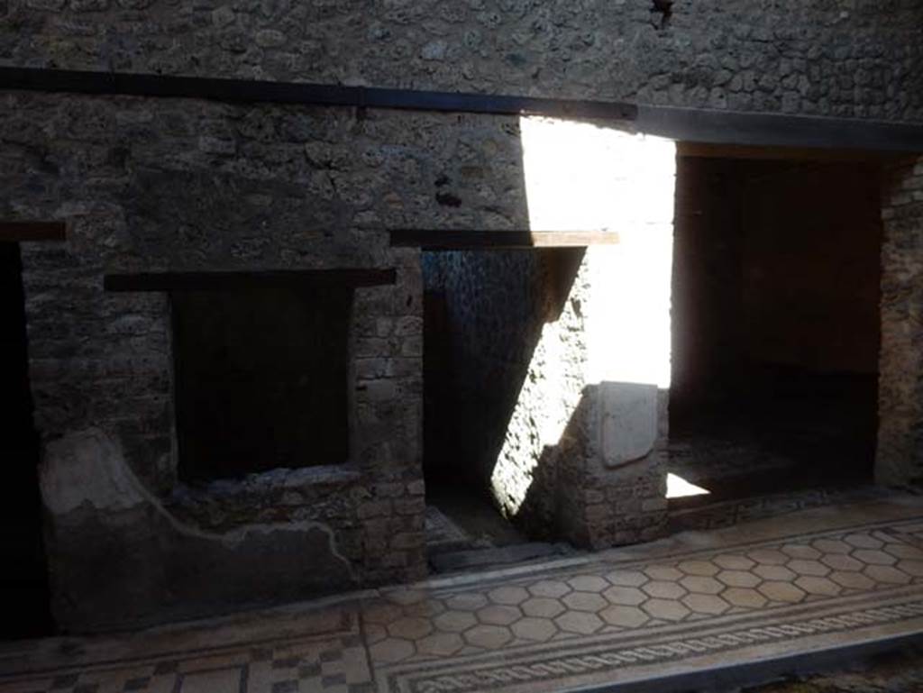 VII.2.45 Pompeii, May 2018. Window and doorway to cubiculum in centre of east side of atrium.
On the right is the doorway to a triclinium in south-east corner of atrium. Photo courtesy of Buzz Ferebee.