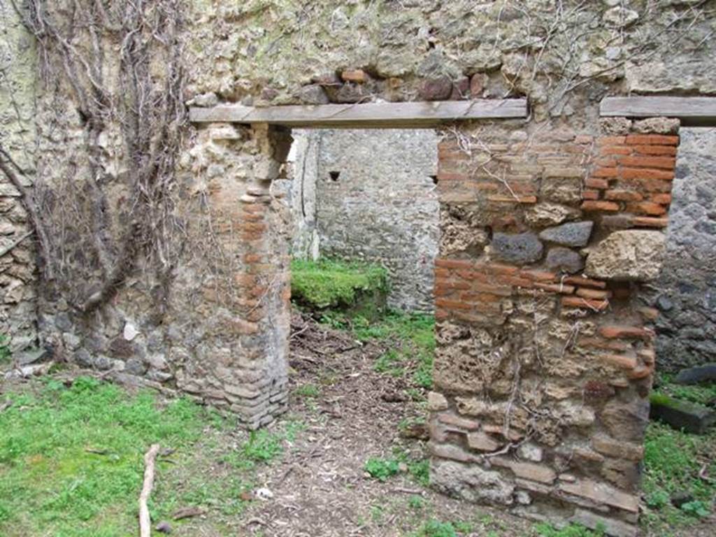 VII.3.4 Pompeii. March 2009. Doorway to Kitchen, in south wall of garden.