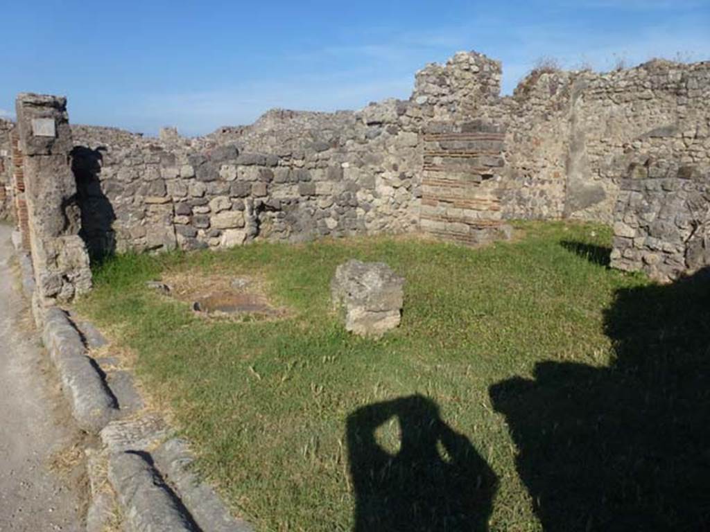VII.3.4 Pompeii. June 2012. Looking towards east side of shop, across site of counter, with remains of 3 urns. Photo courtesy of Michael Binns.
