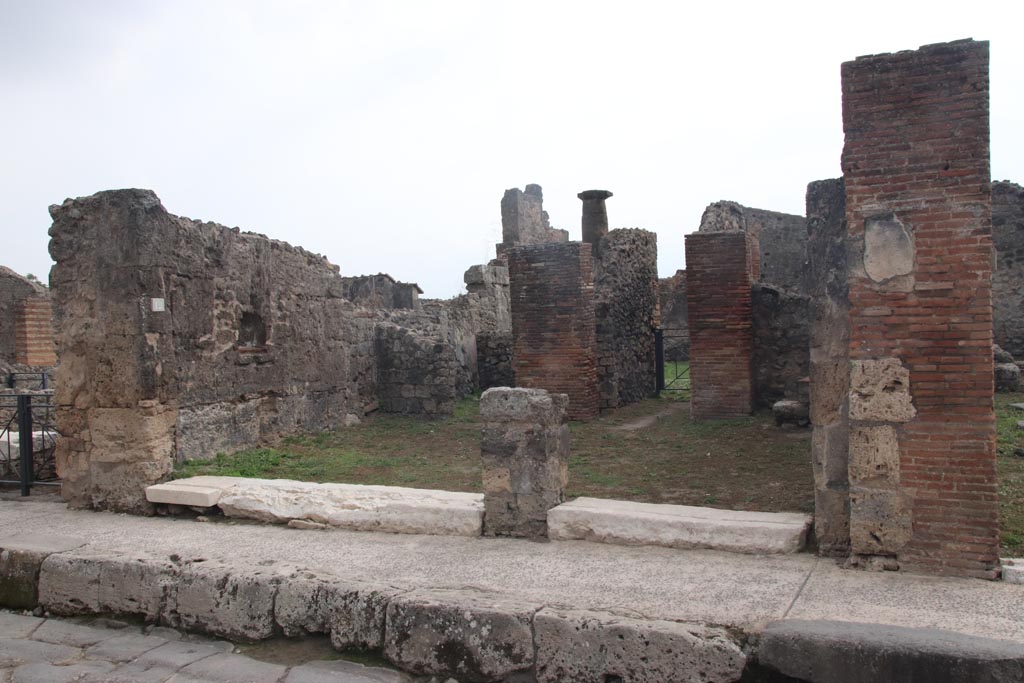 VII.3.12 on left and VII.3.11, on right, Pompeii. October 2023.
Looking south to both entrance doorways. Photo courtesy of Klaus Heese.