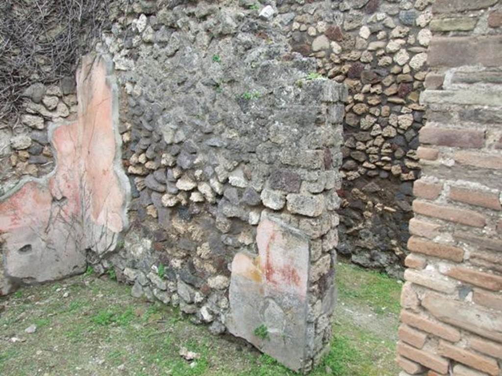 VII.3.12 Pompeii. March 2009. West wall of rear room of shop, with doorway to corridor of VII.3.11.