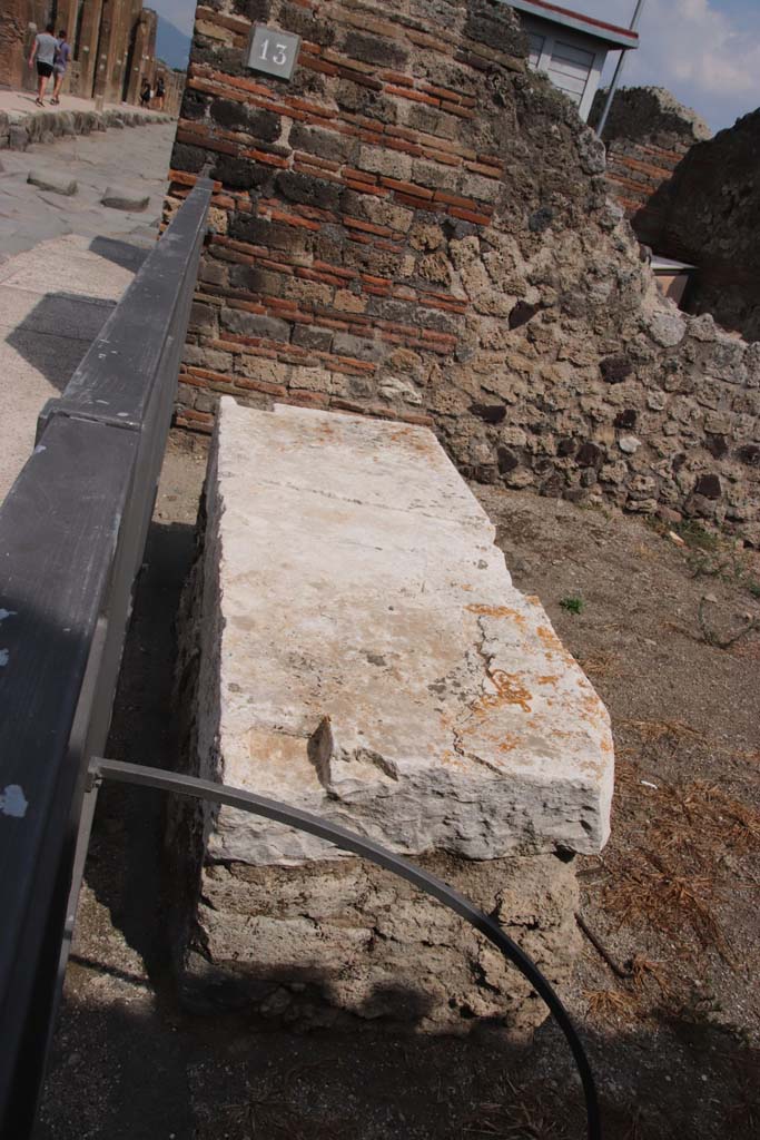 VII.3.13 Pompeii. September 2021.
Looking east across marble podium at entrance doorway. Photo courtesy of Klaus Heese.